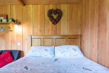 The comfy, handmade king-size bed, complete with lovely linen.