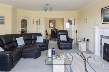 The sitting-room leads into the separate dining-room.