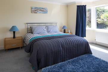 Master bedroom boasts a super inviting super-king size bed. This bedroom is on the ground floor.