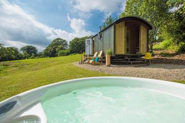 Have a soak in the hot tub, taking in the views.