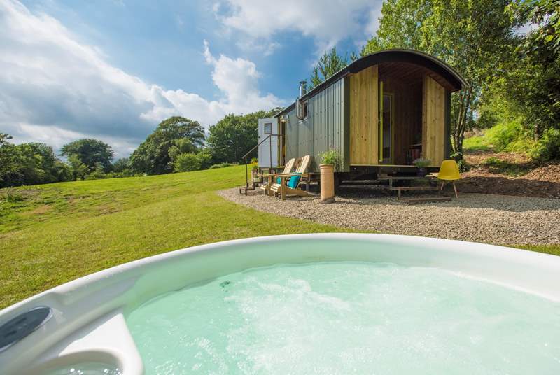 Have a soak in the hot tub, taking in the views.