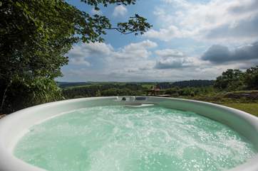 There is even a bubbling hot tub with spectacular far reaching views across the valley and countryside beyond.