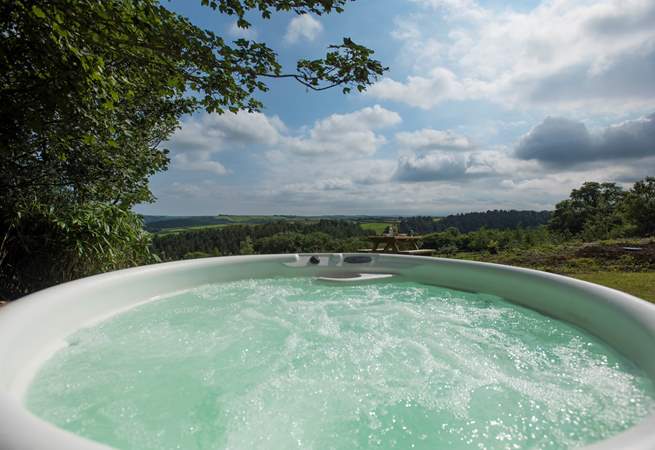 There is even a bubbling hot tub with spectacular far reaching views across the valley and countryside beyond.