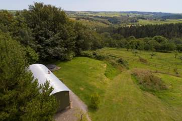 The Lion's Den nestled into the meadow with the most outstanding views.