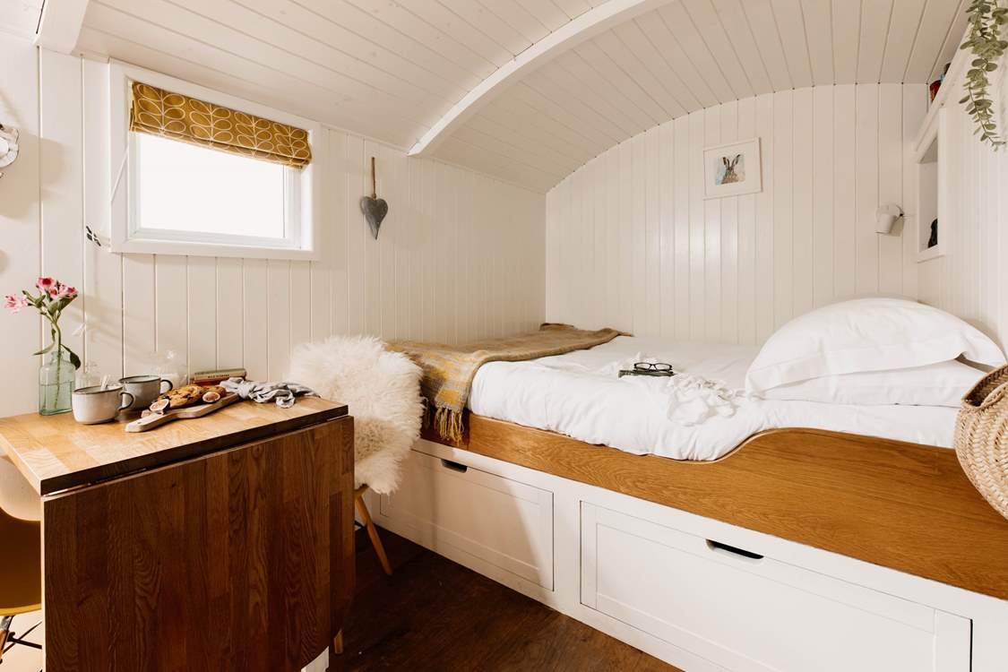 Cocoon yourself in the king-sized bed