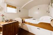Cocoon yourself in the king-sized bed