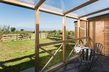 The glass-roofed verandah overlooking the back garden.