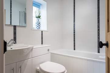 The family bathroom has both a bath and fitted shower above.