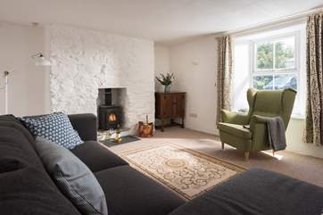 The sitting-room has a lovely little wood-burner, perfect for winter stays.
