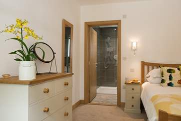 Bedroom 1 benefits from an en suite bathroom.