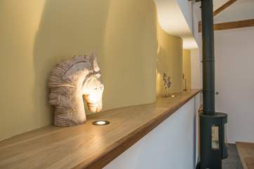 Sensitively restored, the owners have retained some of the original features including the exposed beams and the 'crinkle crankle' wall.
