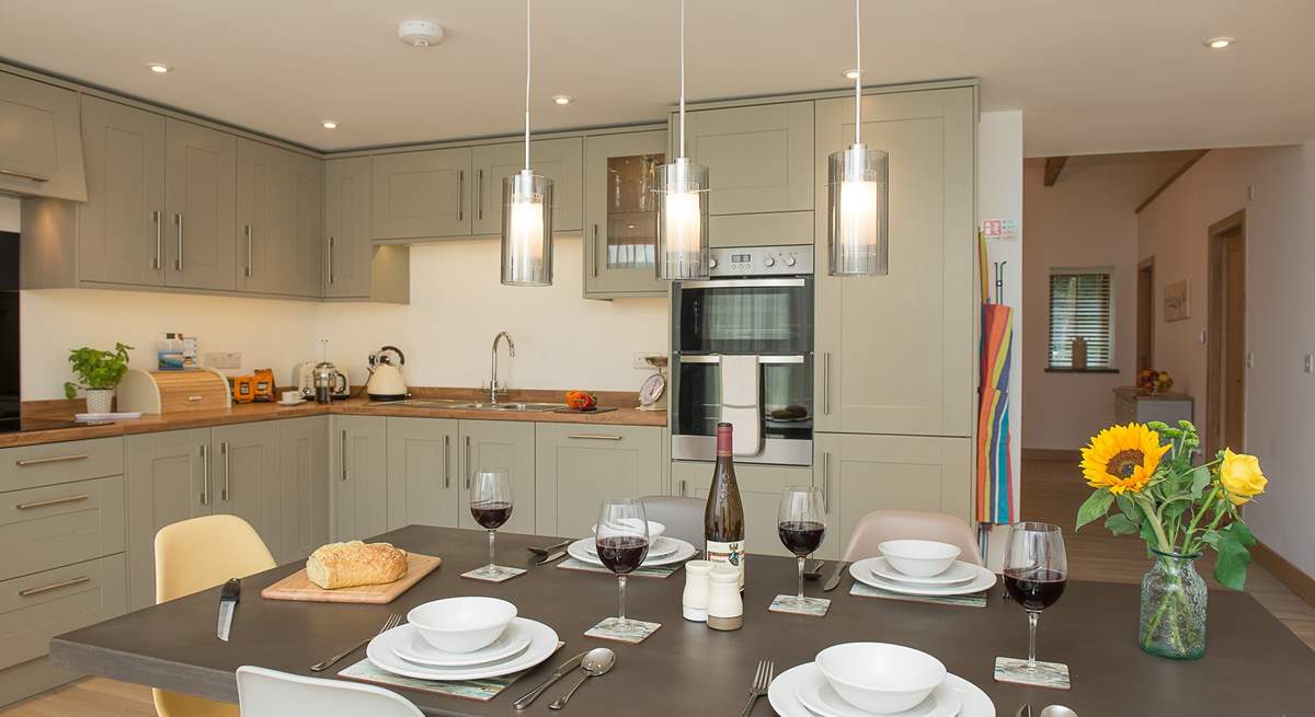 Although open plan, the kitchen/dining-area sits separate to the sitting-area giving the best of both worlds.