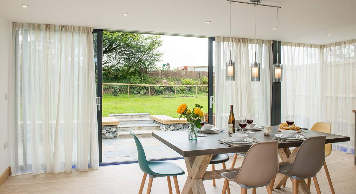 The wrap around windows make this room incredibly light and of course give easy access to the garden.