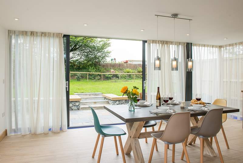 The wrap around windows make this room incredibly light and of course give easy access to the garden.