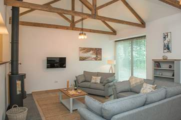 The spacious sitting-area has ample room for everyone to spread out and relax.