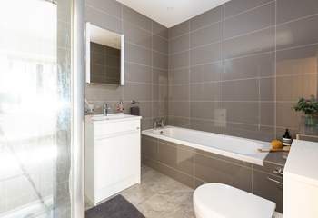 The en-suite bathroom for bedroom 1 has a shower and separate bath. 
