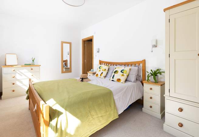 This bedroom is light and airy. 