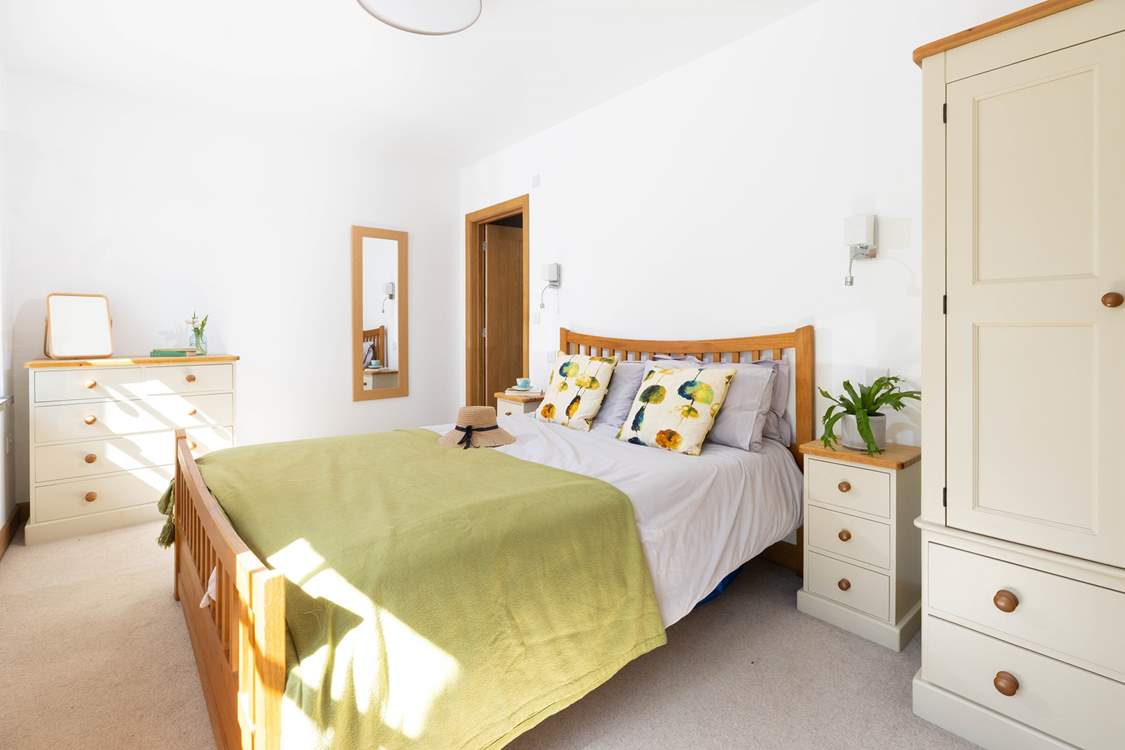 This bedroom is light and airy.