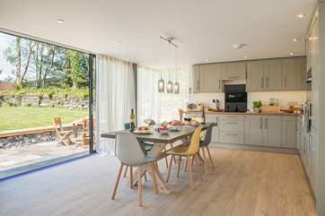 The huge windows let the light flood in and give easy access to your private garden area.