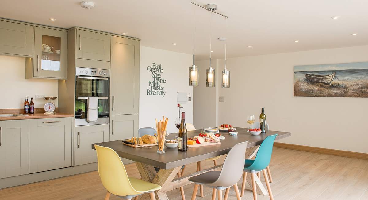 Although open plan, the kitchen and dining-area are separate from the sitting-area giving you the best of both worlds.