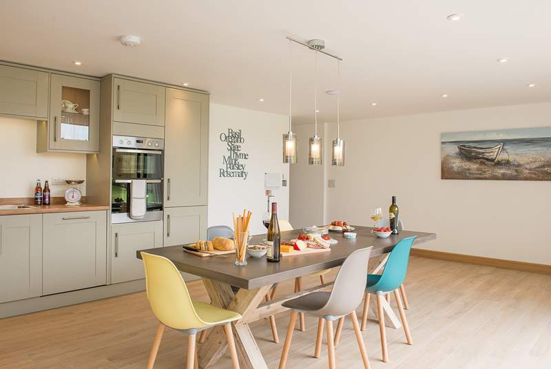 Although open plan, the kitchen and dining-area are separate from the sitting-area giving you the best of both worlds.