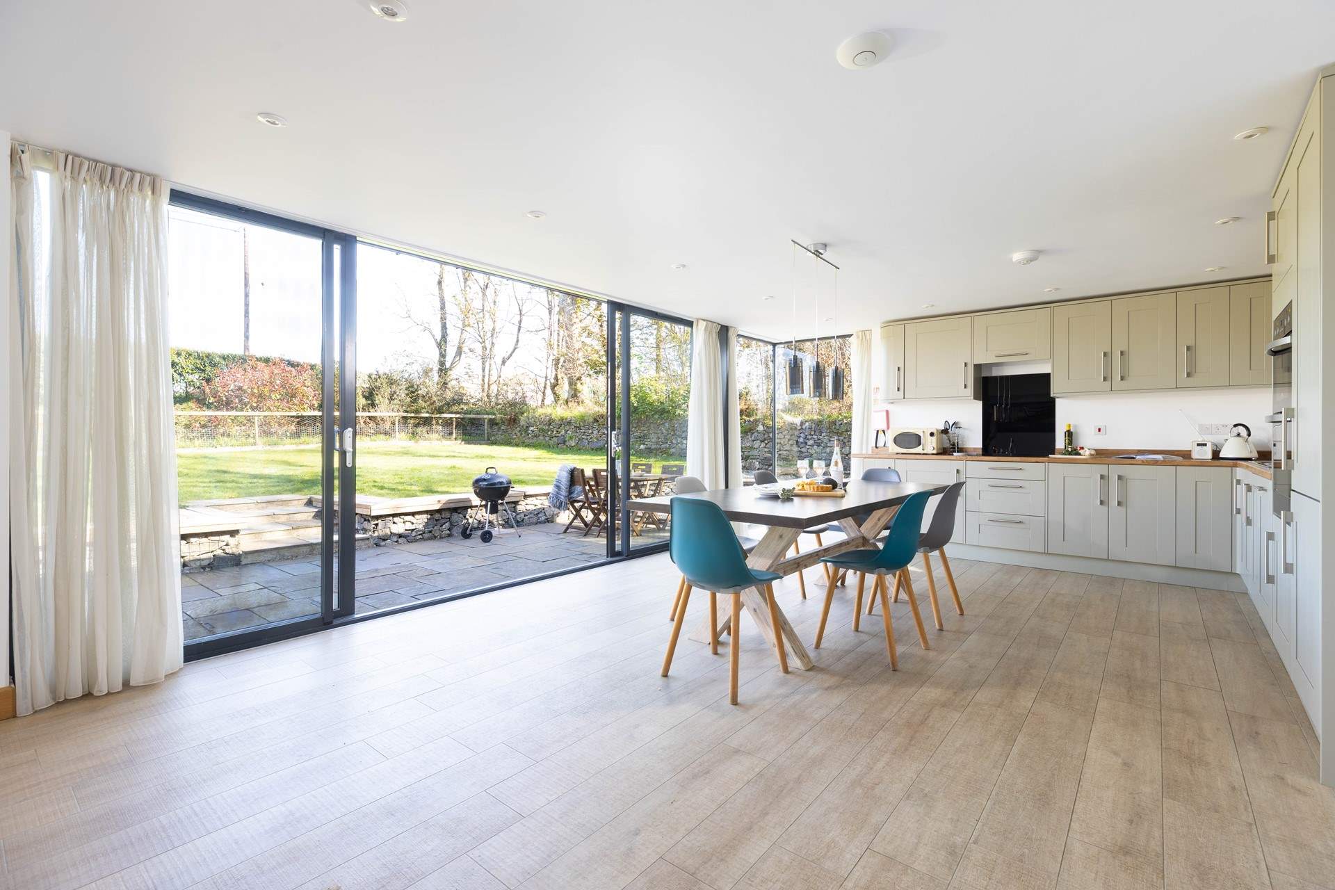 Large windows open to the tranquil garden. 