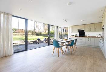 Large windows open to the tranquil garden. 