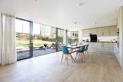 Large windows open to the tranquil garden.