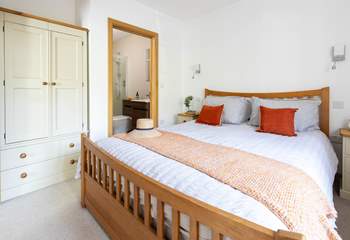 The main bedroom has a luxurious king-size bed and en suite shower-room.