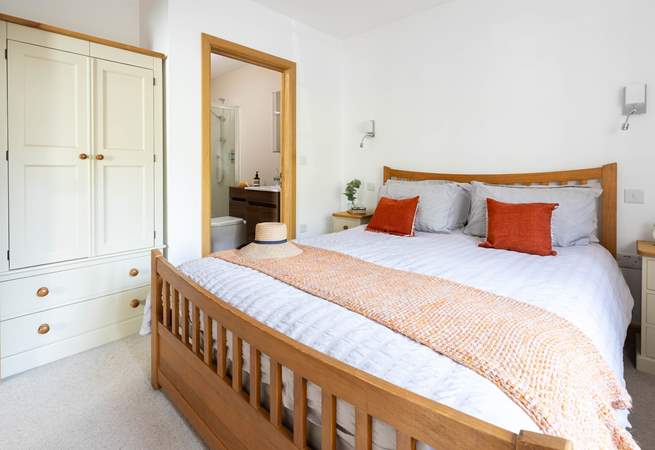 The main bedroom has a luxurious king-size bed and en suite shower-room.