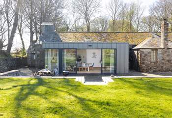 The Coach House has a sunny garden and patio. 