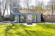 The Coach House has a sunny garden and patio.