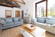 The spacious sitting-room has been thoughtfully converted.