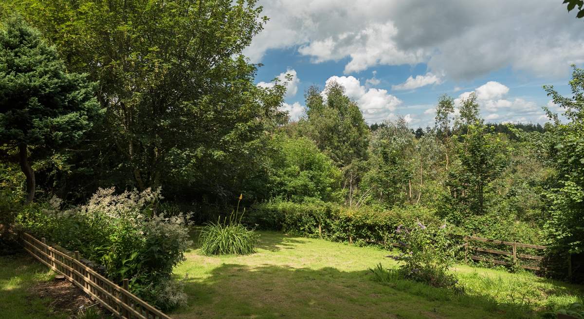 The private, tree-lined garden at Lee Cottage.