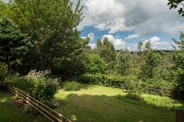 The private, tree-lined garden at Lee Cottage.