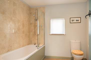 Enjoy a soothing holiday soak in the family bathroom, but of course there is also a shower if you have a little less time.