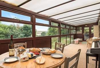 The large conservatory is a lovely space to enjoy holiday meals...