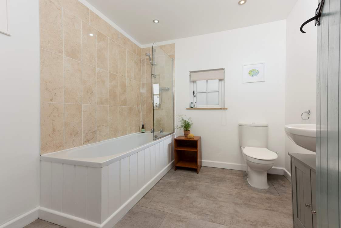 Enjoy a soothing holiday soak in the family bathroom, but of course there is also a shower if you have a little less time.