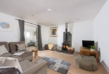 The wood-burner is perfect for cosy film nights snuggled up on the corner sofa.