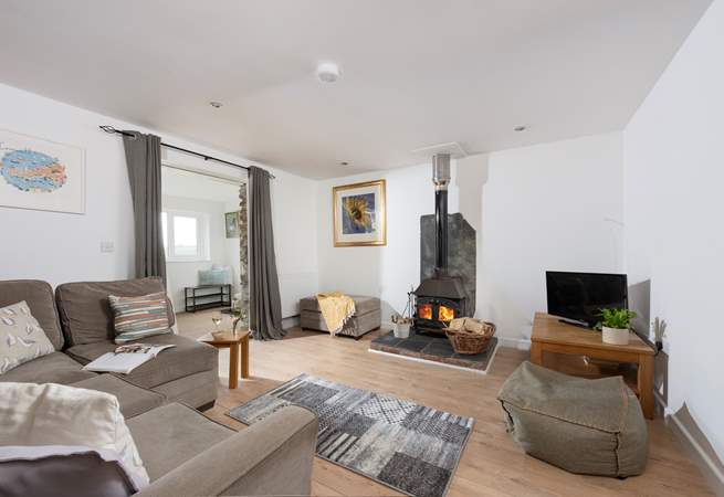 The wood-burner is perfect for cosy film nights snuggled up on the corner sofa.