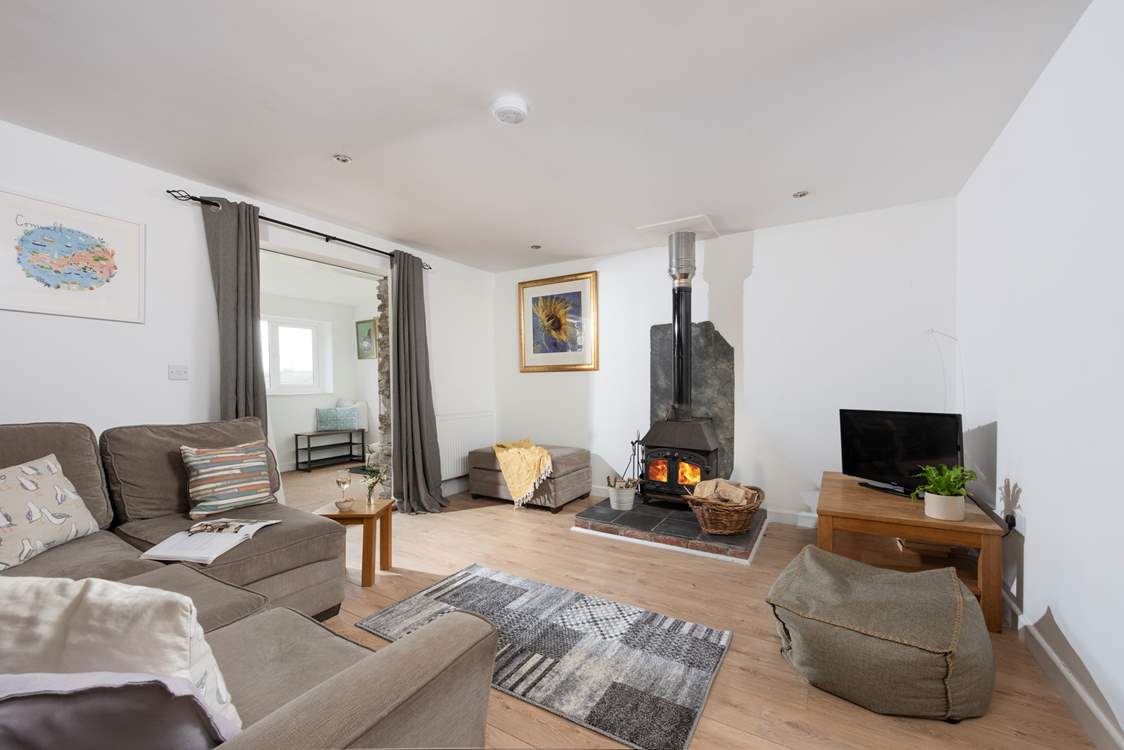 The wood-burner is perfect for cosy film nights snuggled up on the corner sofa.