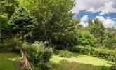 The Garden Room looks out over the garden, which is on two levels with steps from the top area down to the big lawn - Thumbnail Image