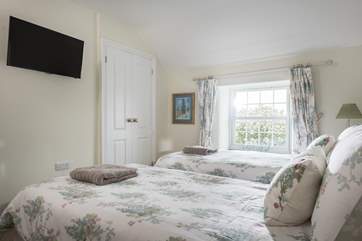 Bedroom 3 has a 32'' TV and overlooks the Green.