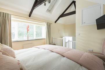 Bedroom 1 is accessed via a short flight of stairs.