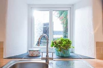 The kitchen sink looks out over a little enclosed courtyard.