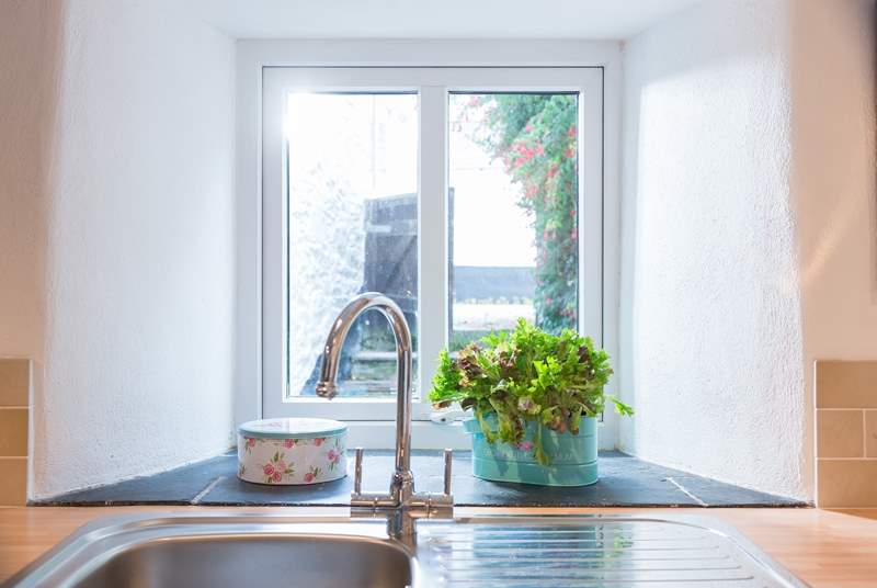 The kitchen sink looks out over a little enclosed courtyard.