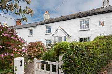 End Cottage is a delightful semi-detached cottage overlooking the village green.