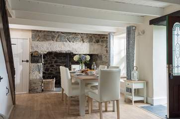 This open plan dining/sitting room creates a very sociable family space with the stairs rising to the first floor bedrooms and bathrooms.