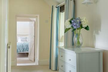 Bedrooms at either end of the hallway