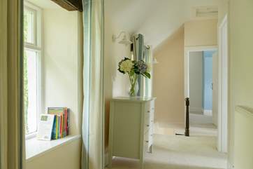 Looking down the hallway towards the stairs and main double bedroom at the end.